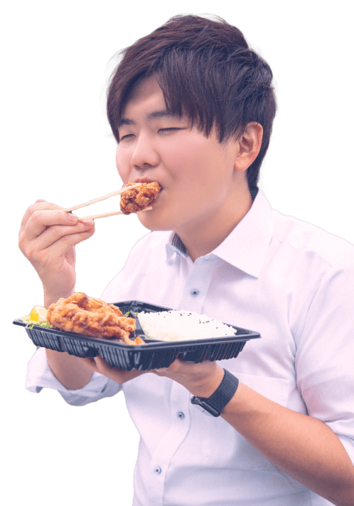 弁当を食べてる人の画像